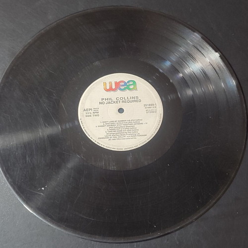 Phil Collins No Jacket Required vinyl record used, scratched, no cover