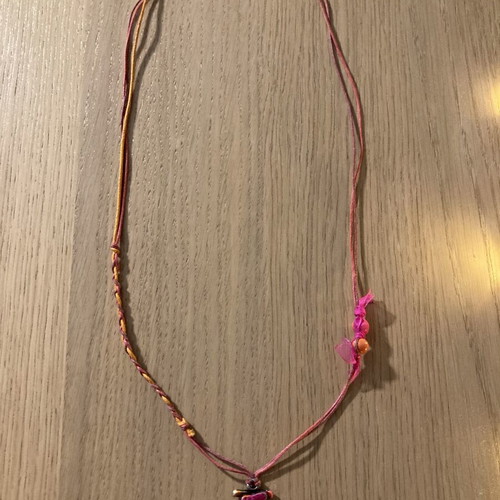 Necklace with musical note on staff, silver motif