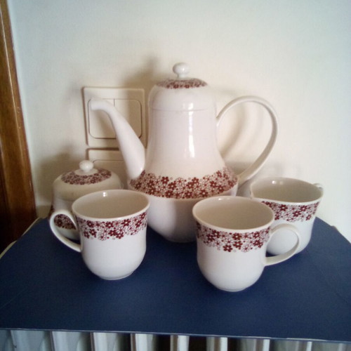Tea set used with teapot, sugar bowl, creamer and two cups Ionian porcelain
