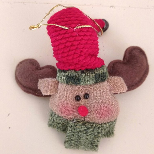 Handmade knitted Christmas ornaments used, Santa and reindeer