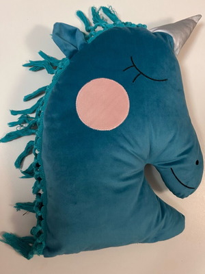 Velvet unicorn pillow used in emerald color