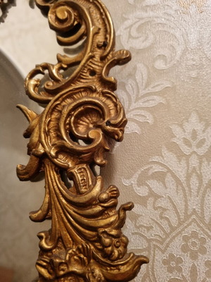 Rococo style wall mirror with gold embossed frame