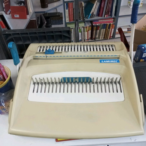 Spiral binding machine used with plastic spirals
