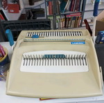 Spiral binding machine used with plastic spirals