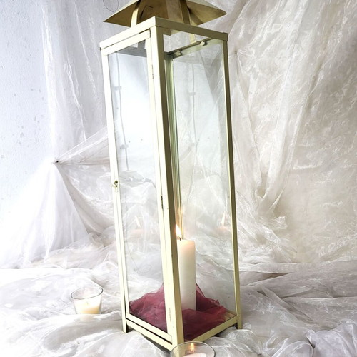 Set of used off-white metal floor lanterns for wedding and baptism