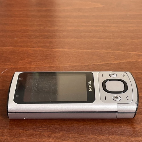 Nokia 6700s phone used with metal body and original battery