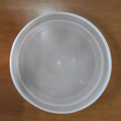 Kitchen utensils used, strainer in tupperware with lids
