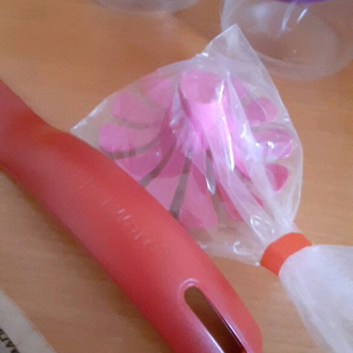Tupperware product set new with collectible spatula and small cups