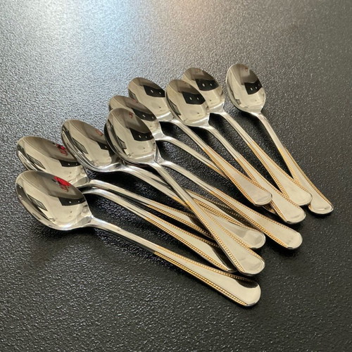 Tray with 12 unused 18/8 stainless steel Amefa dessert spoons like new