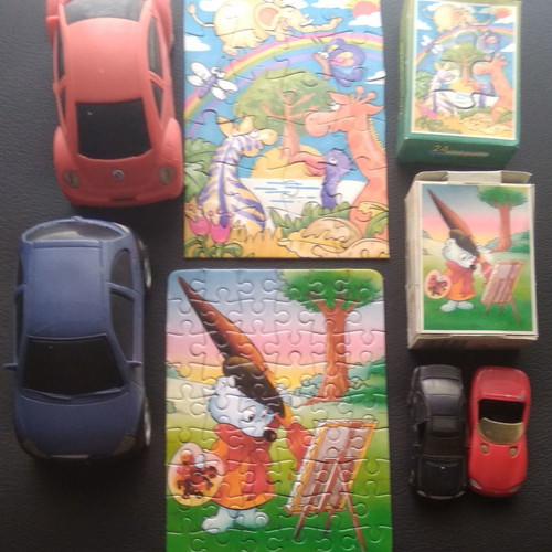 Toy cars and puzzles used, set of 4 cars and 2 puzzles