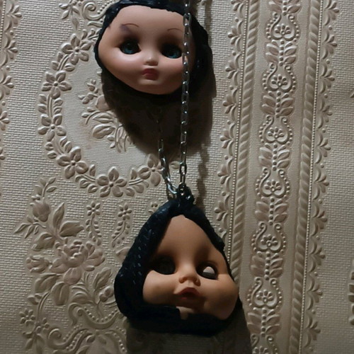 Gothic handmade necklace custom made with old doll heads