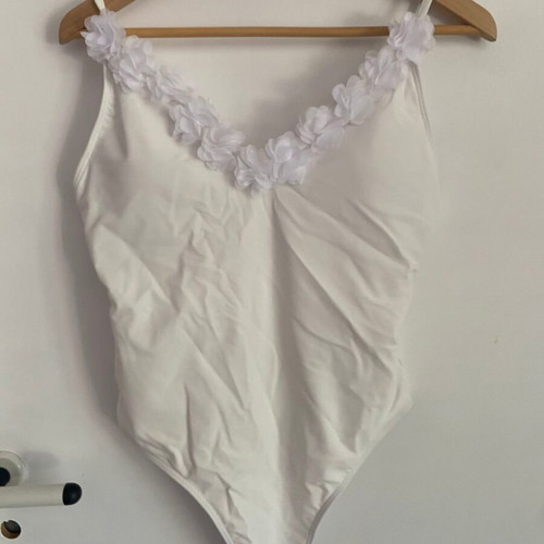 Ladies white swimsuit with flower details, size medium