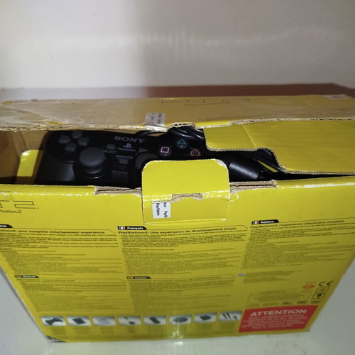 PlayStation 2 console with original controller, memory card and 2 games