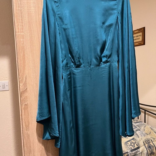 Lace dress used, size Small, with batwing sleeves and open back