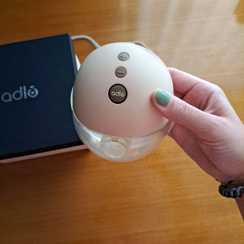 Adlo portable breast pump like new with 2 flanges and unused spare part