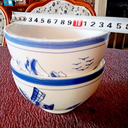 Two flower pots with blue designs