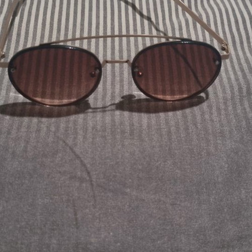 Round glasses used with brown lenses