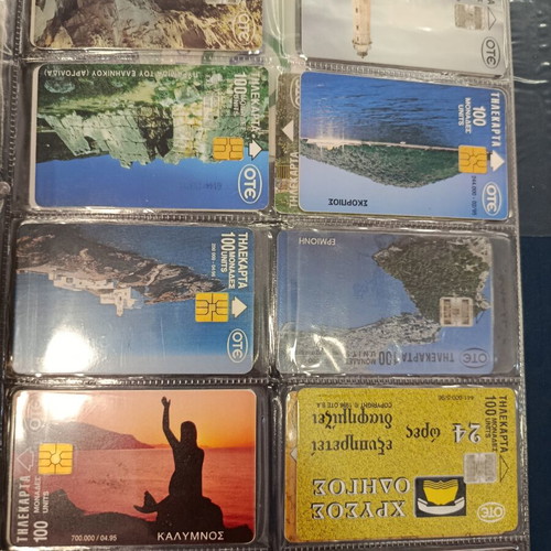 Phone card album with approximately 400 used Greek cards