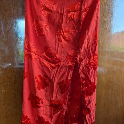 We Coss skirt size medium red with slit and embossed flowers like new
