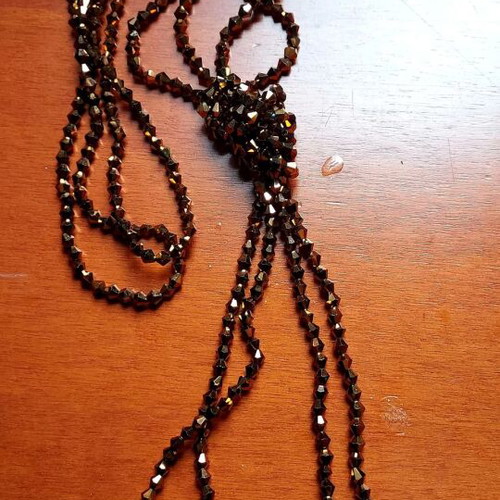 Lariat Necklace like new with brown crystal beads