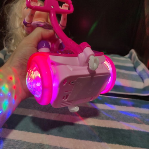 Doll with scooter, sound and lights, like new