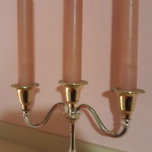 Metal candlestick like new with candles