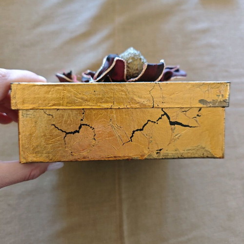 Decorative gold box like new with balls and ribbons