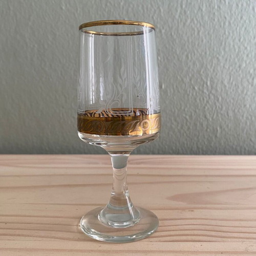 Liqueur glass used with gold design and etched pattern