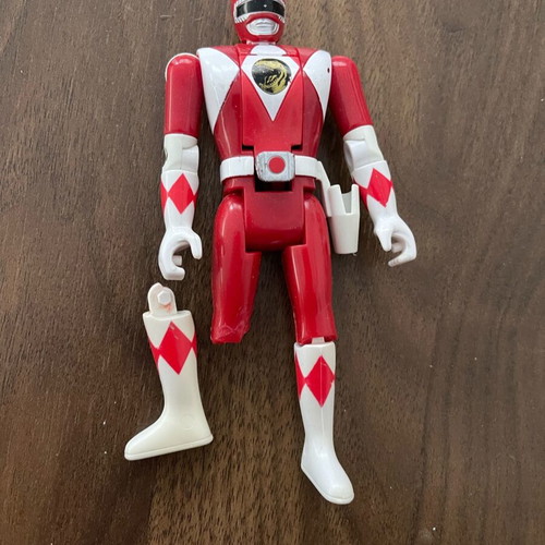 Red Power Ranger figure used, broken with weapon