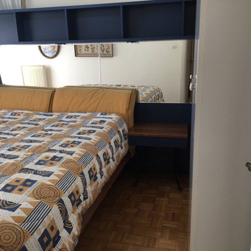 Modern bedroom set used with double bed, mirror, shelves, 2 nightstands, mattress, pillows, and reversible duvet