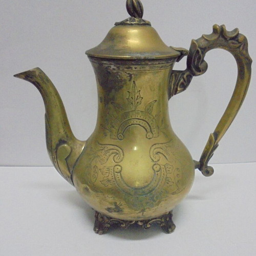 Old bronze teapot with decorative ornaments