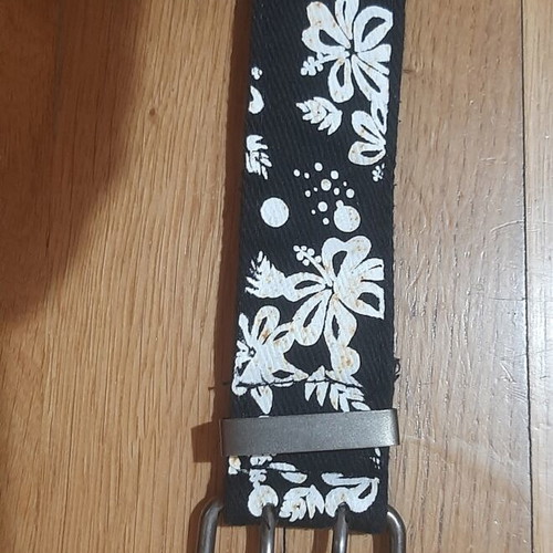 Belt like new, black with white floral pattern, size 110