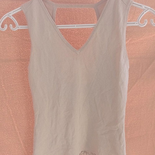 Esti beige top used with back opening, size S