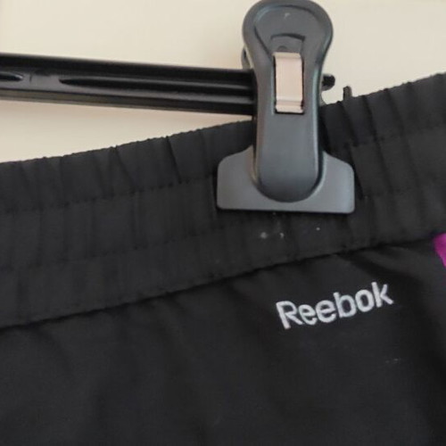 Reebok women's PlayDry ZigTech running shorts used, black and purple, size M