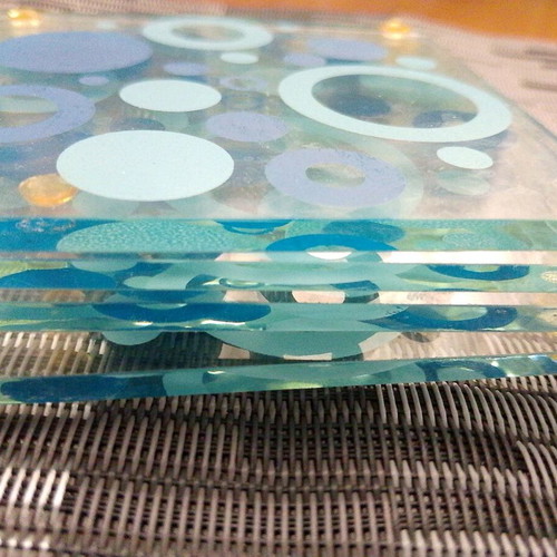 Glass coasters like new, set of 4 with blue details