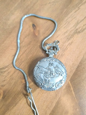Antique pocket watch used with chain and embossed horse design