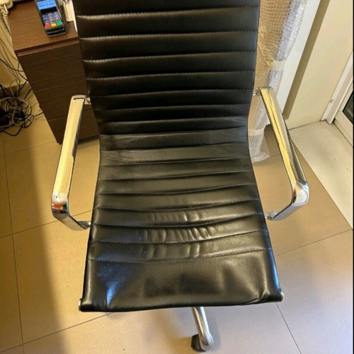 Neoset executive office chair used with ribbed black leather and chrome frame