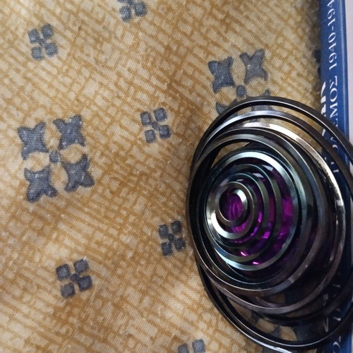 Pendant with long chain used, purple and mirror detail