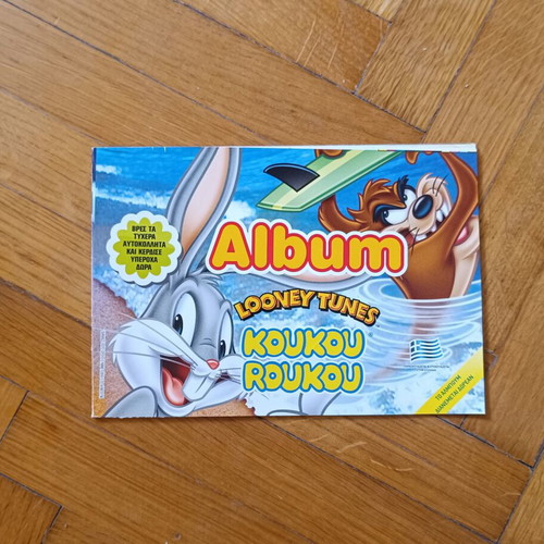 Koukouroukou Looney Lunes sticker album like new with 28 of 54 stickers