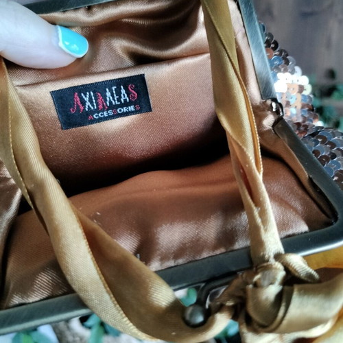 Pouch like new, gold copper with ribbon and sequins