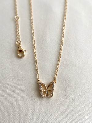 Gold necklace with butterfly design and zircon like new