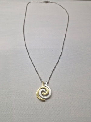 Pendant like new in silver and gold colors