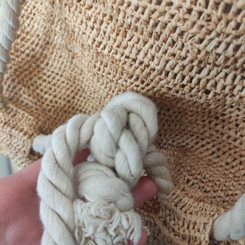 Boho straw backpack used with shells and rope straps, resort style