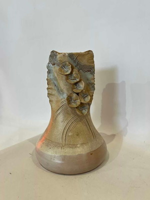 Vintage handmade ceramic vase with embossed flower details used
