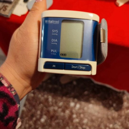 Wrist blood pressure monitor used with broken plastic case