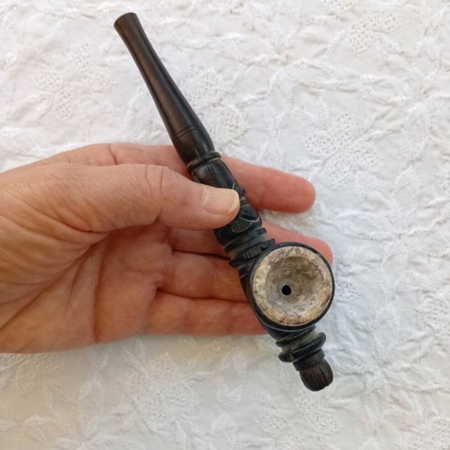 Handmade carved wooden pipe with stone inlay