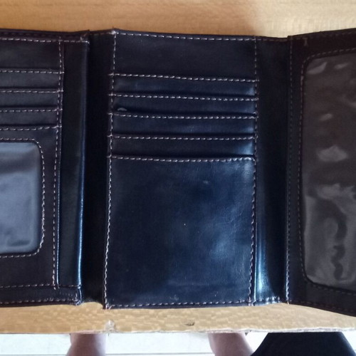Women's black wallet used with photo and money slots