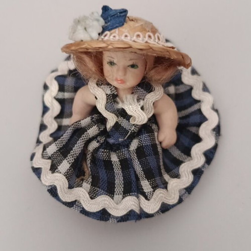 Collectible porcelain doll like new with straw hat and blue checkered dress