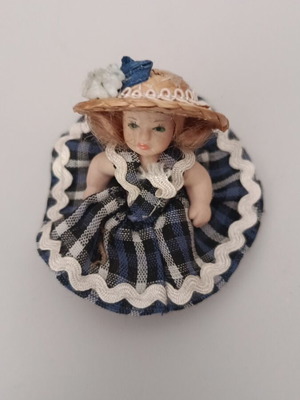 Collectible porcelain doll like new with straw hat and blue checkered dress
