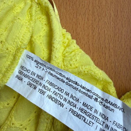 Zara yellow top used with ruffles and asymmetric neckline